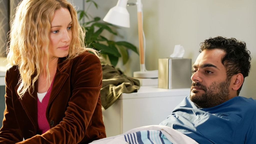 Mags (Laurence Leboeuf) sits next to Bash (Hamza Haq) in Transplant Season 4. (Photo Credit: Courtesy of NBC.)