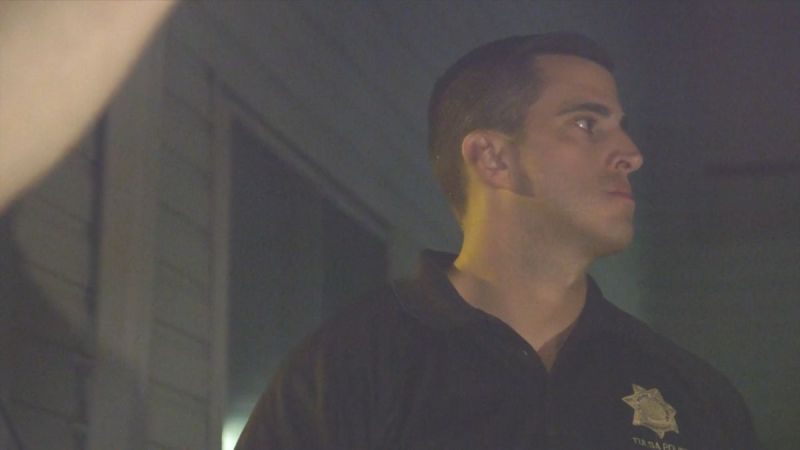 Detective Chase Calhoun stands outside a crime scene in A&E's The First 48. (Photo Credit: Screenshot/Courtesy of A&E.)