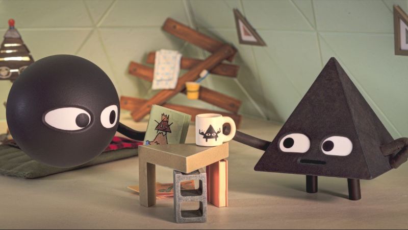 Circle and Triangle share a toast in Shape Island season 2. (Photo Credit: Courtesy of Apple TV+.)