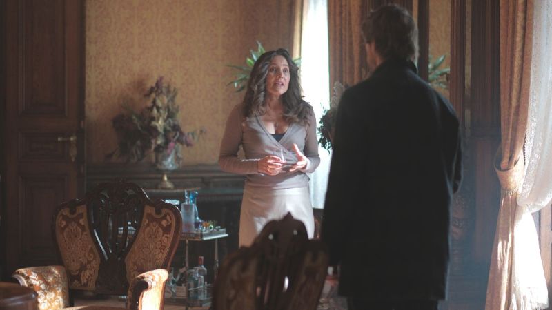 Actor Benjamin Wainwright, back to camera, as Jules Maigret in Maigret season 1, episode 3. (Photo Credit: Courtesy of Playground Entertainment and Masterpiece.)