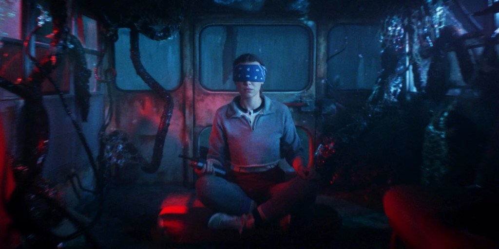 Eleven sitting blindfolded in the back of a vehicle in Stranger Things season 5. (Photo Credit: Courtesy of Netflix.)