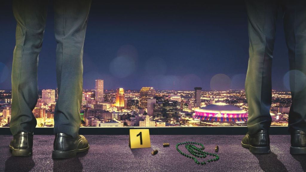 Key art for Homicide Squad: New Orleans Season 3 depicts two detectives standing at a crime scene. (Photo Credit: Courtesy of A&E.)