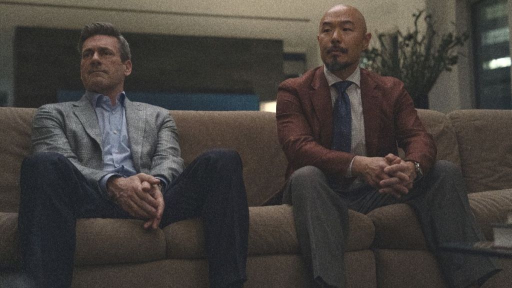 Jon Hamm as Coop as Hoon Lee as Barney in Your Friends and Neighbors season 2 episode 2. (Photo Credit: Courtesy of Apple TV.)